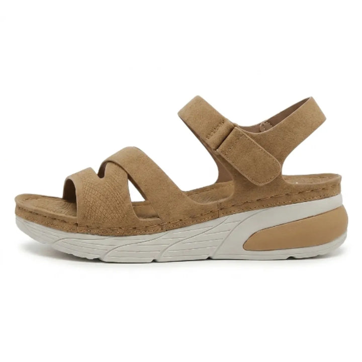Supportive women's comfort footwear for foot pain relief, with orthopedic arch support & adjustable straps.
