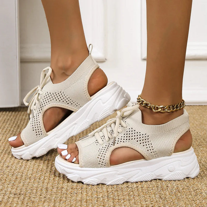 Side view of women's orthopedic sandals with cushioned sole & adjustable straps for walking comfort.