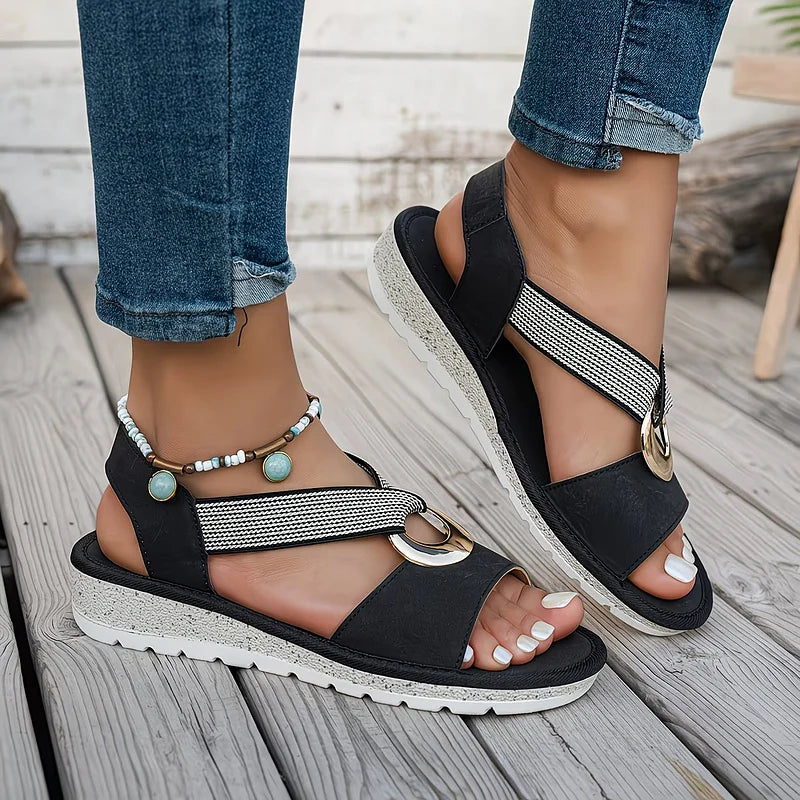 Close-up of women's orthopedic sandal with soft stretch strap, providing arch support & walking comfort.