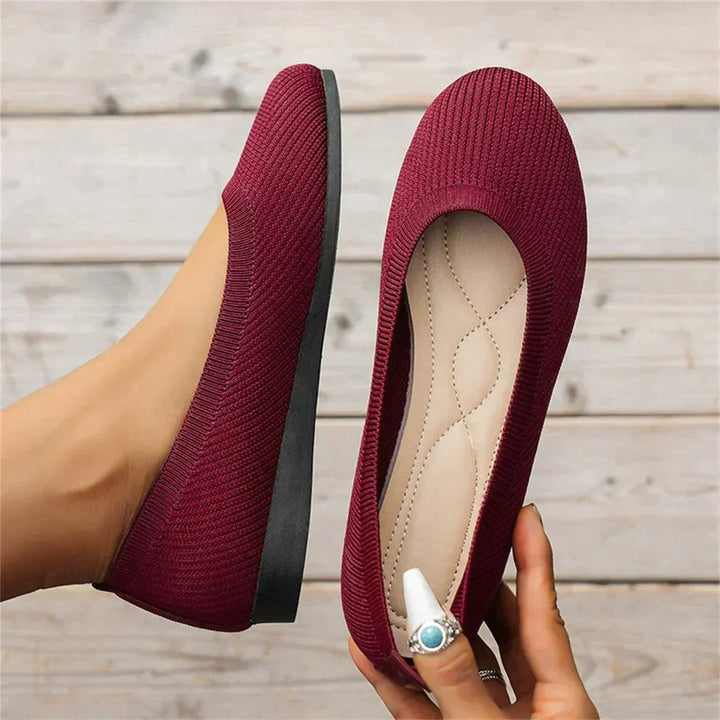 A woman wearing comfortable slip-on orthopedic shoes with memory foam, walking for daily support.