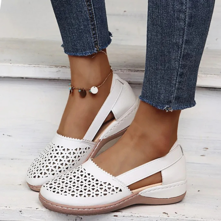 Breathable women's orthopedic slip-on flats with cutout design, perfect summer footwear for casual comfort.