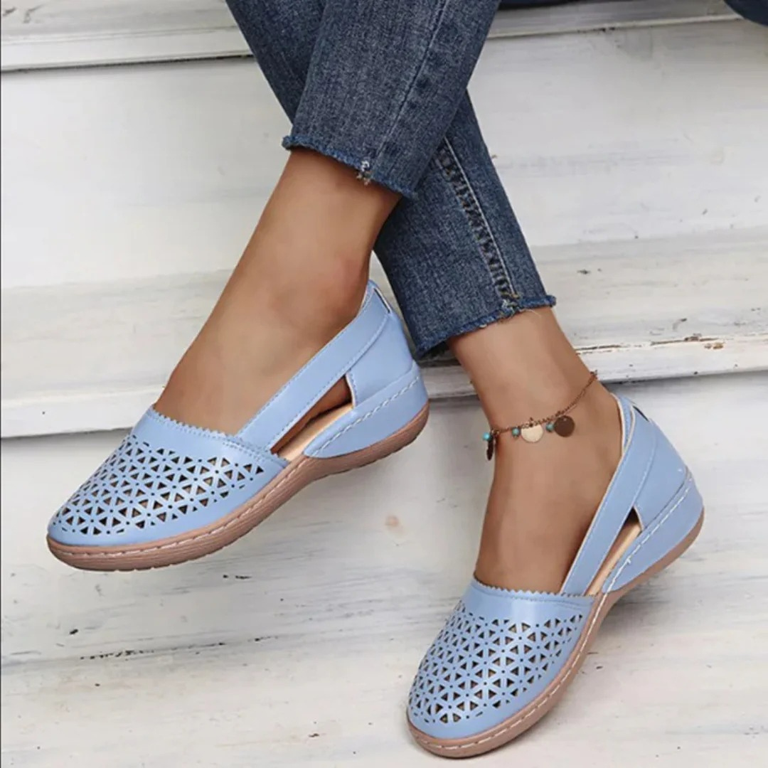 Stylish women's summer slip-on flats featuring a breathable cutout design, ideal casual spring footwear.