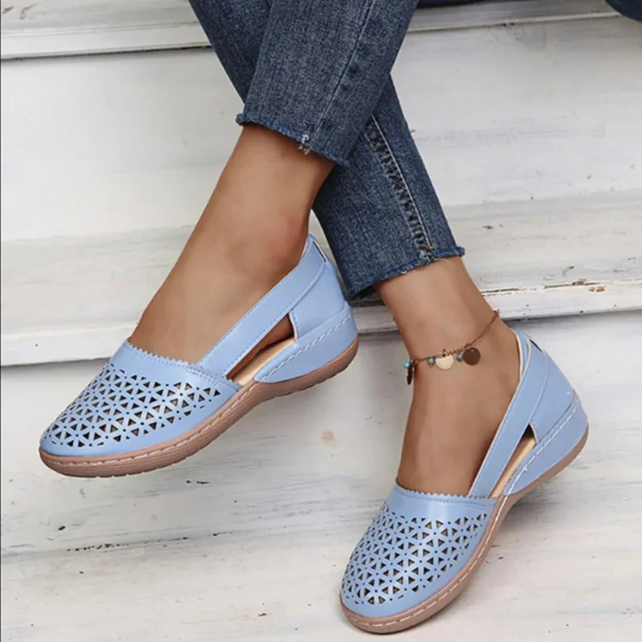Stylish women's summer slip-on flats featuring a breathable cutout design, ideal casual spring footwear.