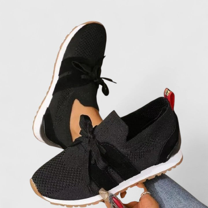 Women's orthopedic slip-on walking sneakers, offering all-day comfort, foot support & breathable design.