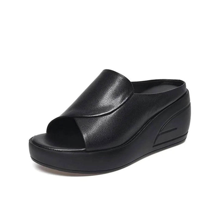 Stylish women's wedge sandals, slip-on design for easy wear. Fashionable and supportive summer comfort footwear.
