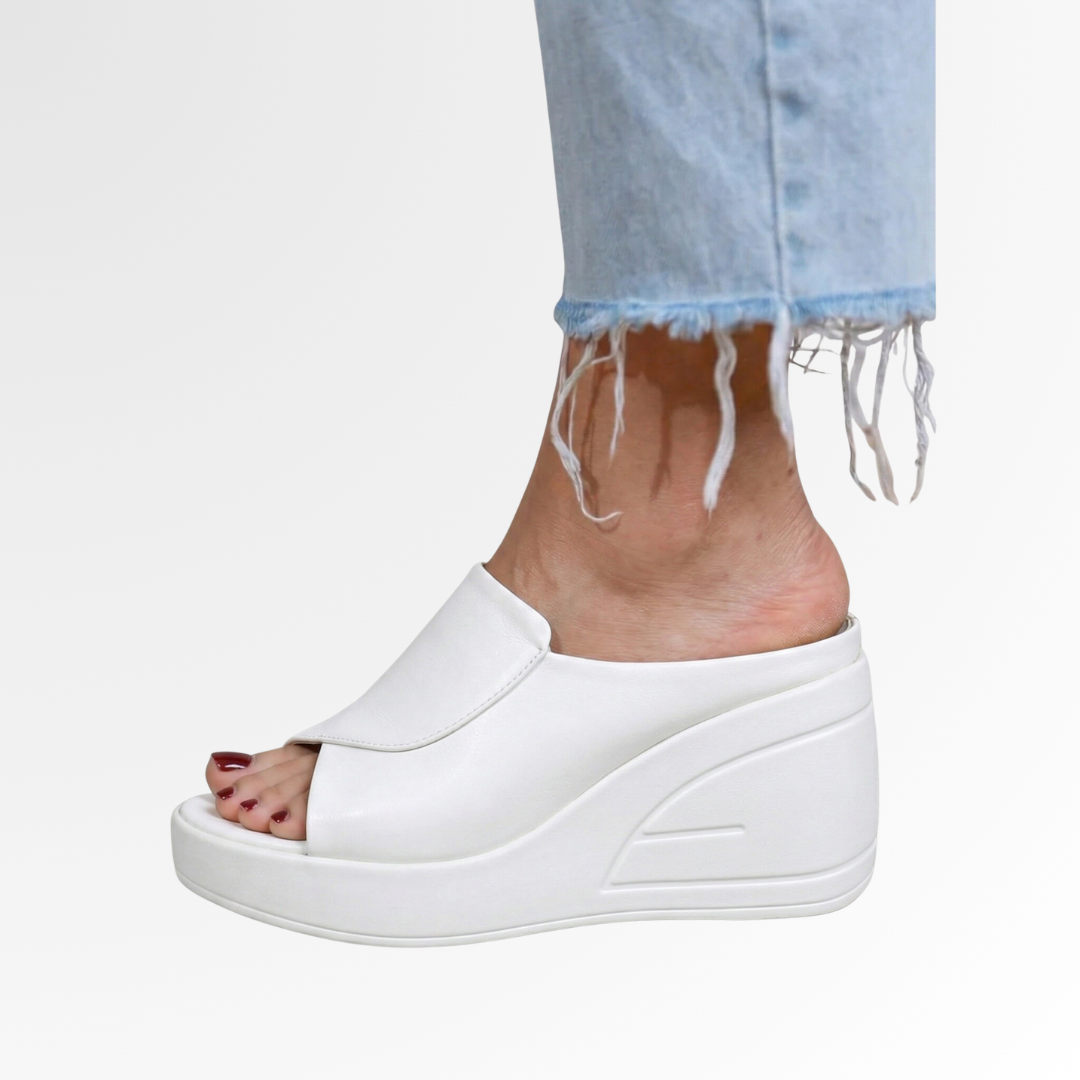Casual women's orthopedic wedge sandals, supportive and comfortable slip-on design for relaxed summer days.