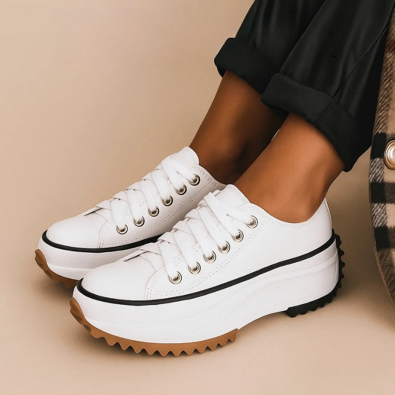 White women's orthopedic walking sneakers with advanced arch support for comfortable everyday wear.