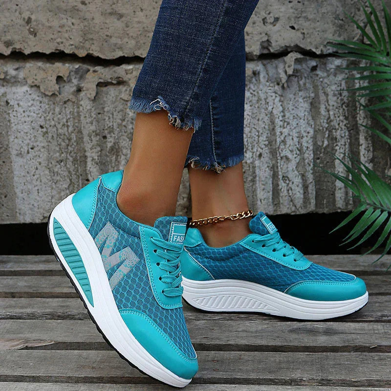 Side view of women's orthopedic walking sneakers, showcasing corrective design & comfortable fit.