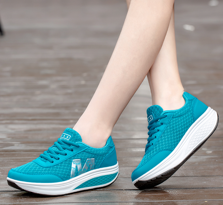 Pair of black women's orthopedic corrective walking shoes for superior comfort and posture support.