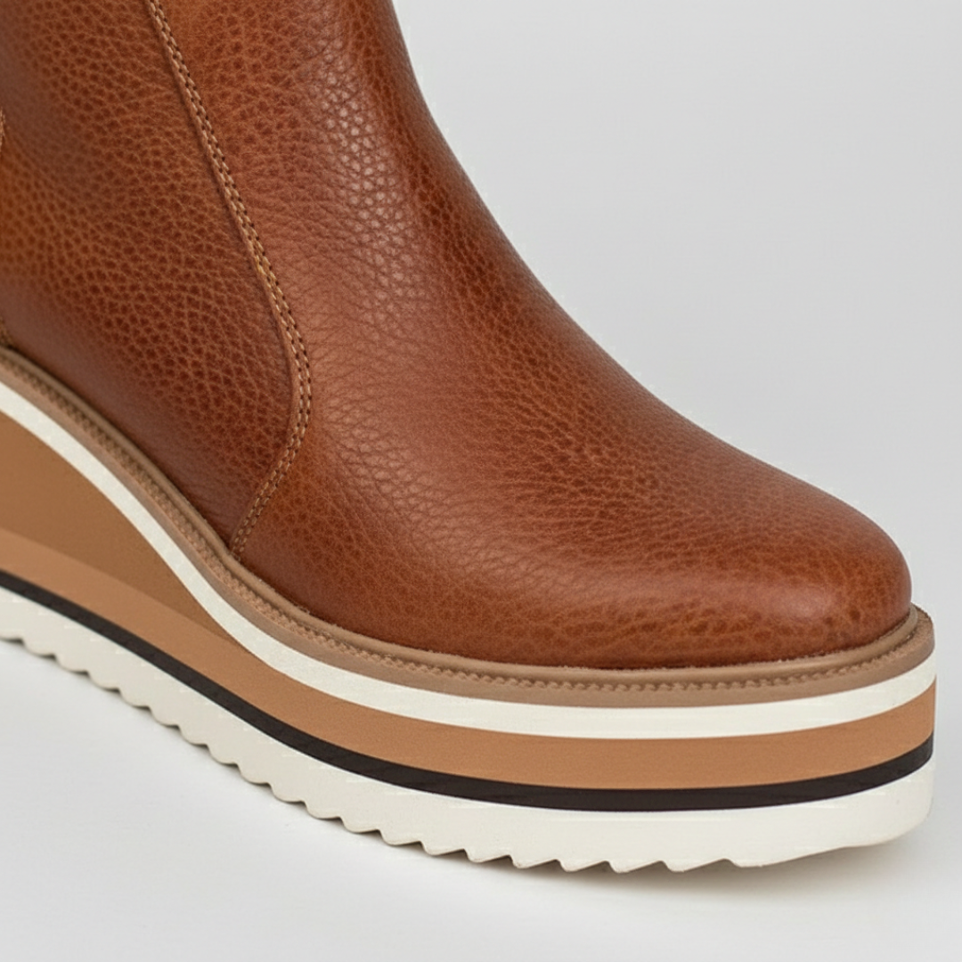 Supportive brown orthopedic wedge heel ankle boots for women, offering comfort and style.