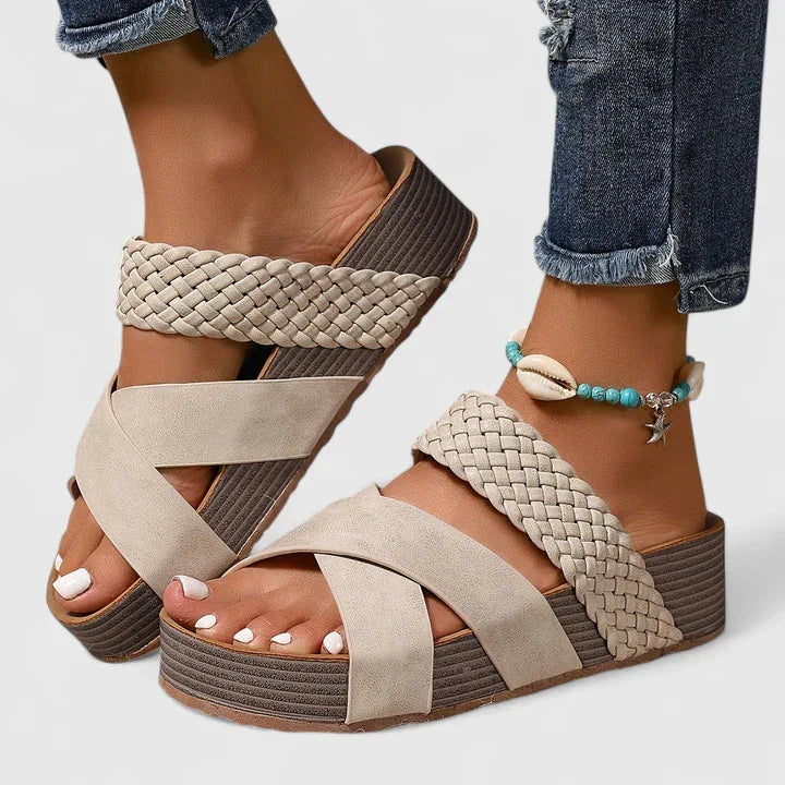 Stylish women's slip-on wedge sandals featuring chic woven crossover straps and orthopedic comfort.
