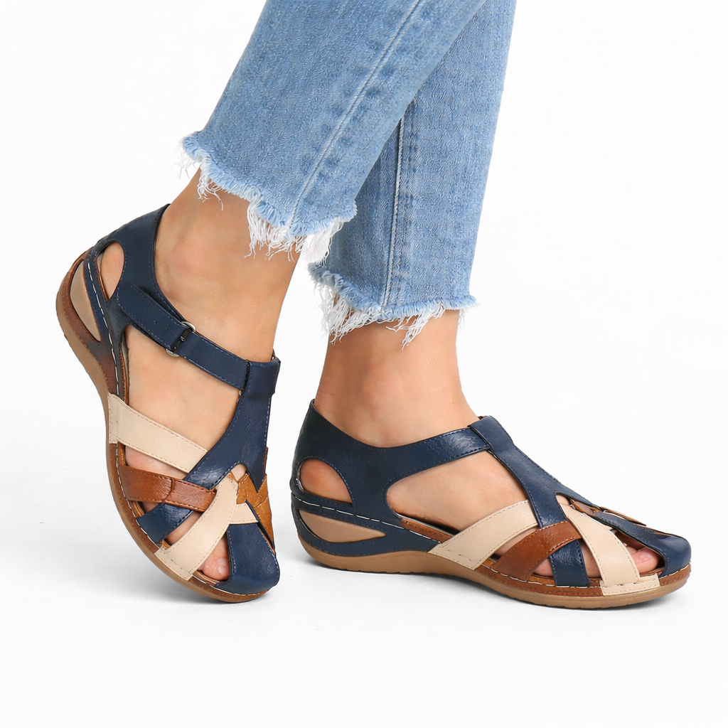 Close-up of women's orthopedic wedge sandals, showing adjustable straps & cushioned footbed for arch support.