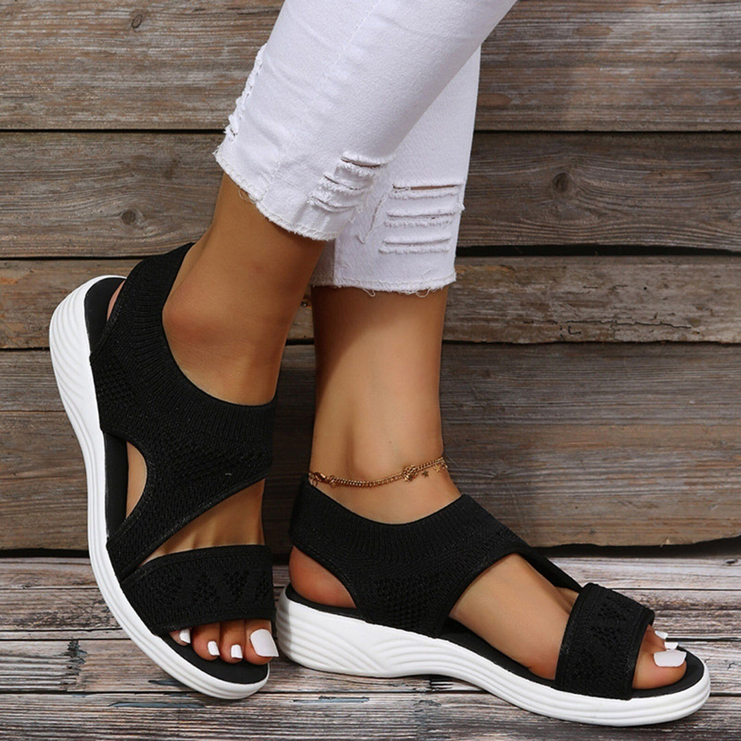 Women's orthopedic wedge sandals with arch support for all-day comfort. Features wide fit & elastic straps.