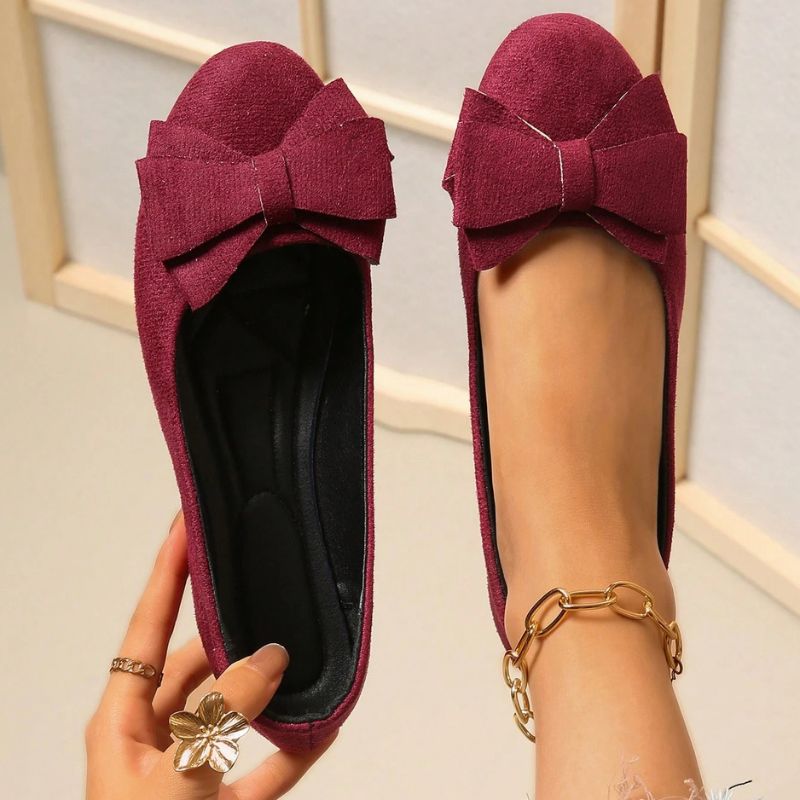 Supportive women's wide fit ballet flats, orthopedic design for arch support.