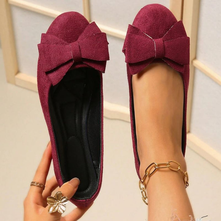 Supportive women's wide fit ballet flats, orthopedic design for arch support.