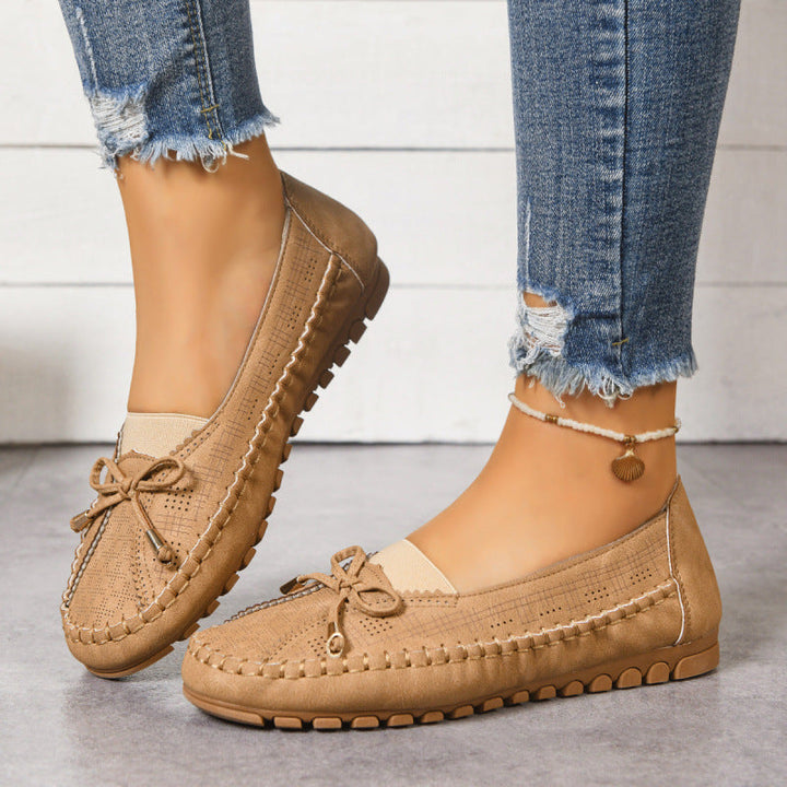 Women's orthopedic wide fit slip-on loafers, offering cushioned comfort for everyday wear.