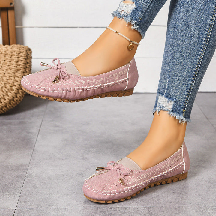 Supportive women's orthopedic loafers, wide fit slip-on design for cushioned comfort.