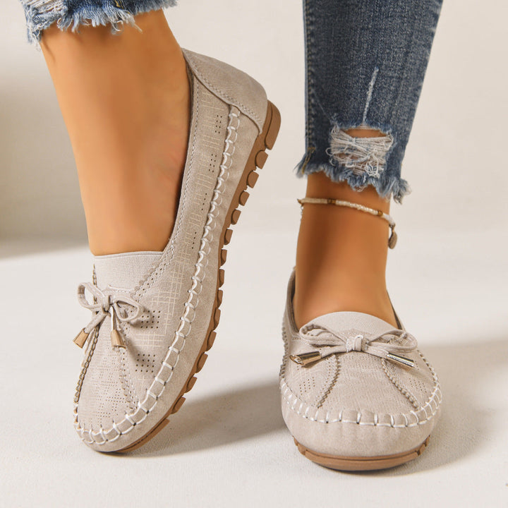 Comfortable women's slip-on loafers with orthopedic features and a wide, supportive fit.