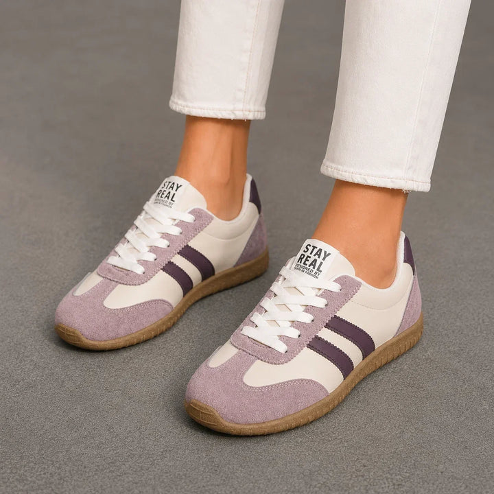 Heel detail of women's orthopedic wide fit trainers. Cushioned for comfort, providing essential arch support for daily wear.