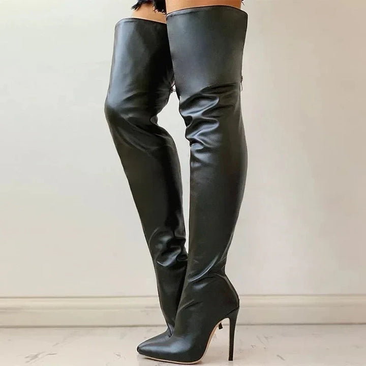Front view of women's over the knee stiletto boots, showcasing the pointed toe & high heel. Elegant fashion footwear.