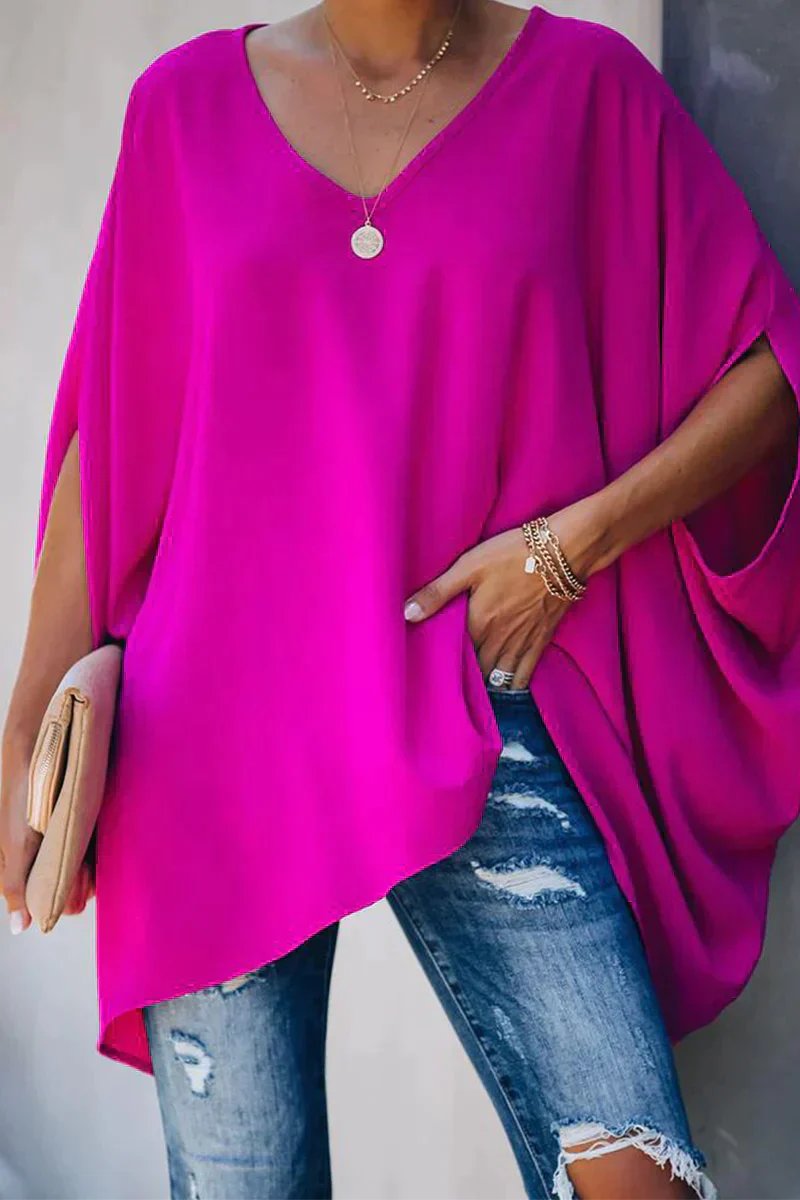 Women's oversized batwing tunic top with relaxed V-neck fit for casual, comfortable everyday style.