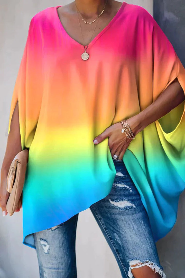 Fashionable women's oversized top with batwing sleeves and V-neck, perfect for a relaxed fit.