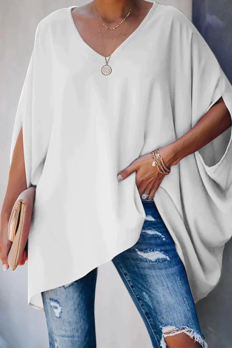 Stylish women's batwing sleeve tunic, an oversized V-neck top for versatile fashion and relaxed wear.