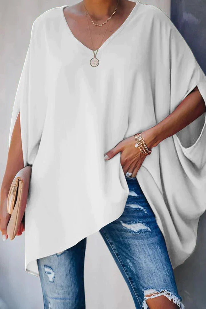 Stylish women's batwing sleeve tunic, an oversized V-neck top for versatile fashion and relaxed wear.