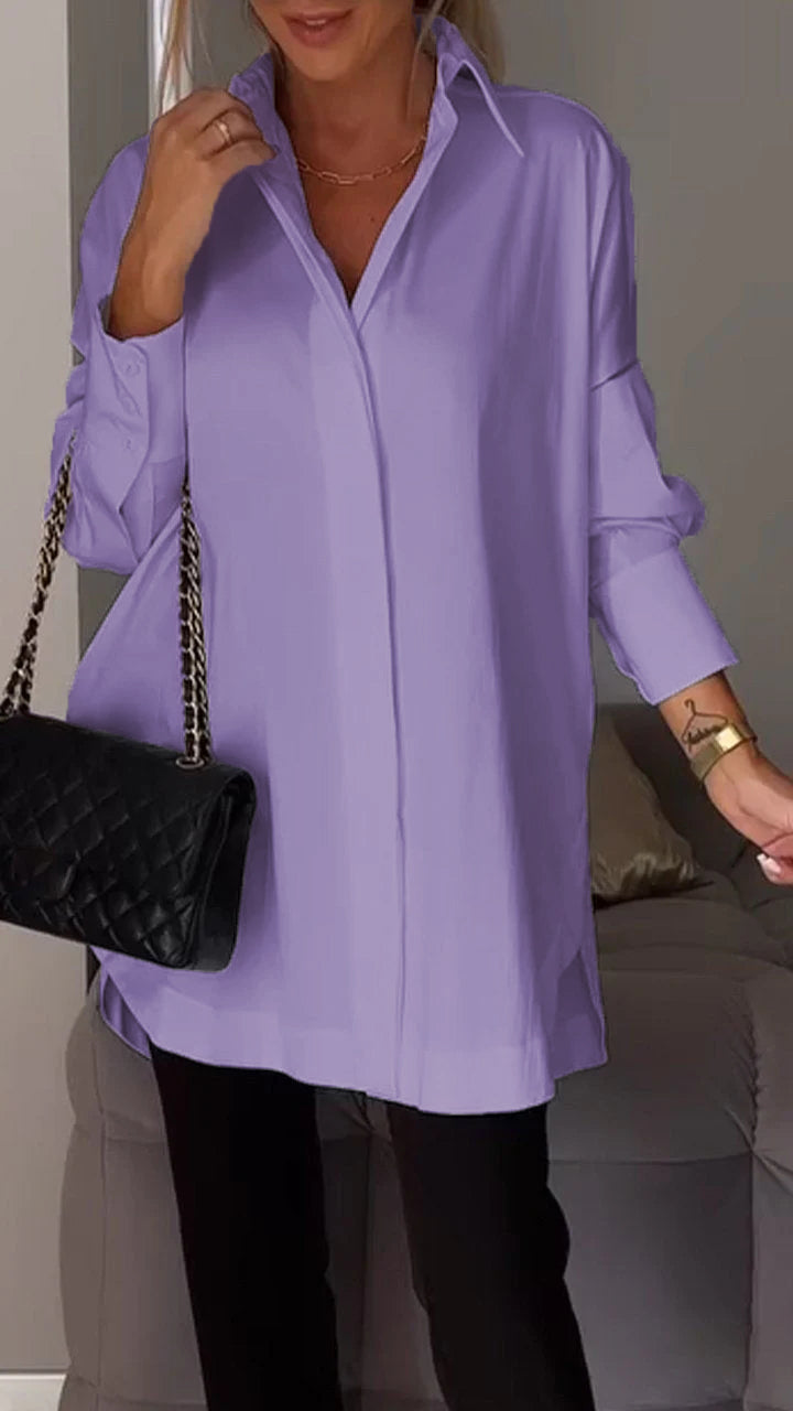 Comfortable women's oversized shirt with a classic collar. A versatile long-sleeve top for various styles.