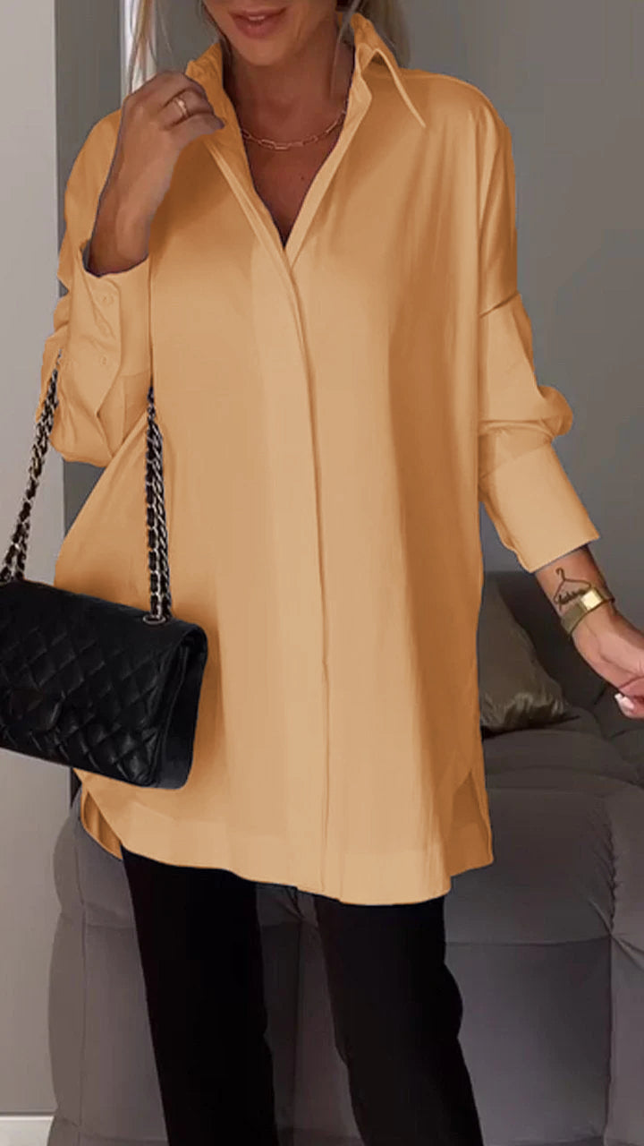 Elegant oversized blouse with a classic collar & long sleeves. Button-down design for versatile women's fashion.