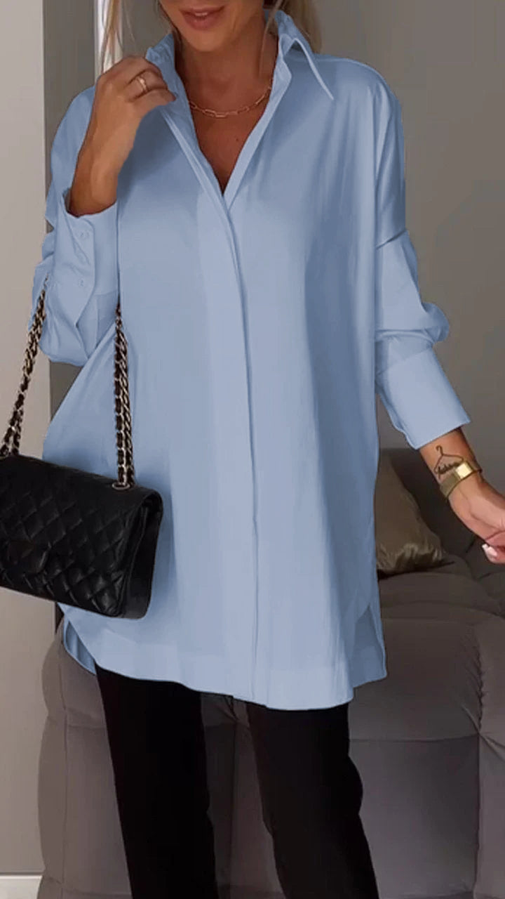 Modern women's blouse, an oversized collared top that blends comfort with effortless classic style.