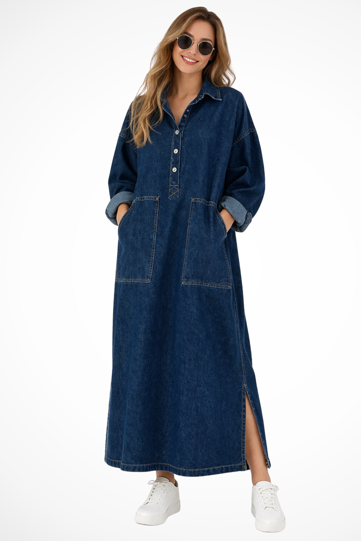 Women's oversized blue denim maxi shirt dress with practical pockets, ideal for casual, comfortable wear.