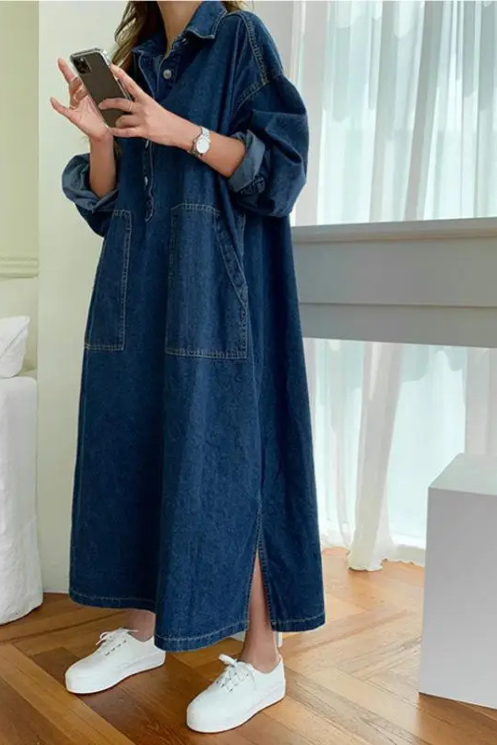 Relaxed fit women's denim maxi shirt dress, versatile and casual with a button front and stylish blue wash.