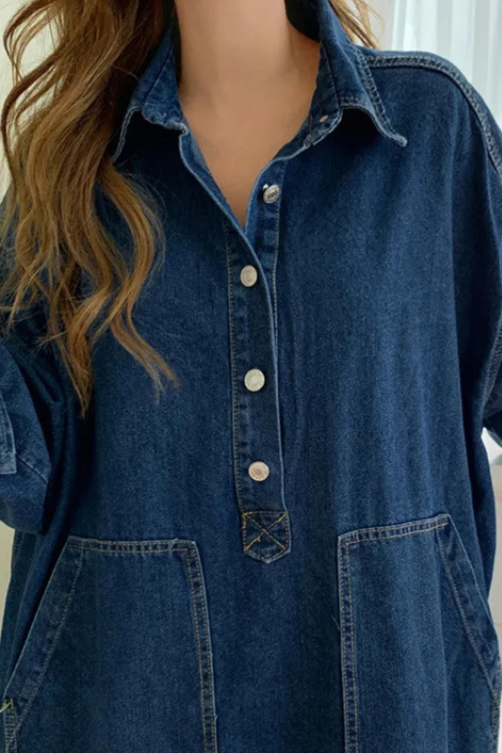 Long women's denim maxi dress in a comfortable, oversized shirt style with a practical button front.