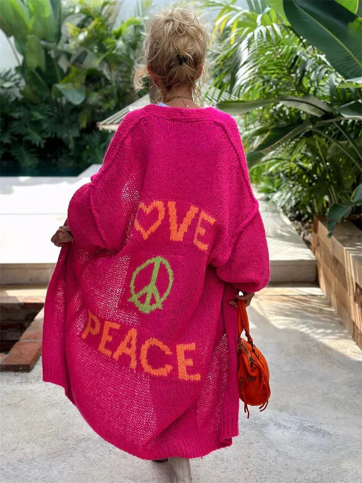 Women's oversized bohemian longline cardigan, "Peace" slogan, vibrant colors, relaxed fit.