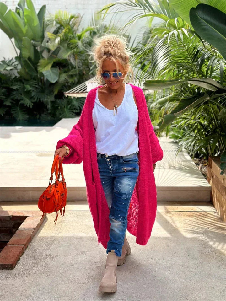Relaxed fit women's oversized bohemian cardigan with bold "Peace" slogan, colorful, hippie style.
