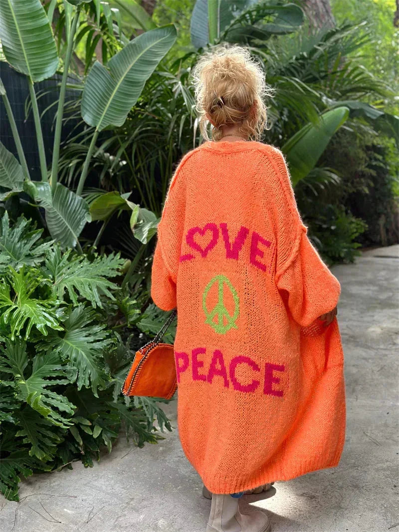 Hippie style women's long bohemian cardigan, "Peace" slogan knitwear, vibrant, casual outerwear.