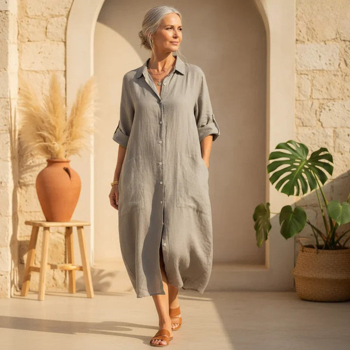 Women's oversized button-down midi shirt dress with pockets. Perfect casual, versatile wear.