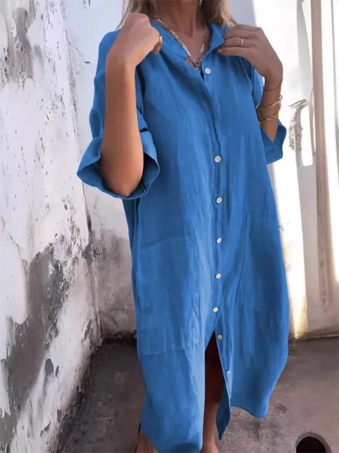 Back view of a women's oversized midi shirt dress, highlighting its comfortable, easy-wear silhouette.