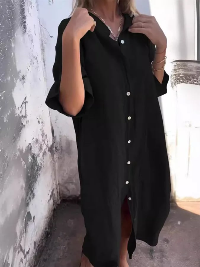 Detail shot of the buttons and practical pockets on a women's oversized button-down shirt dress.