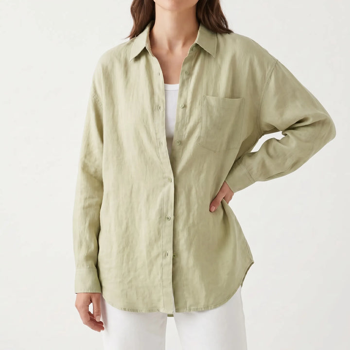 Chic oversized women's button-down shirt with a relaxed fit, ideal for versatile casual styling.