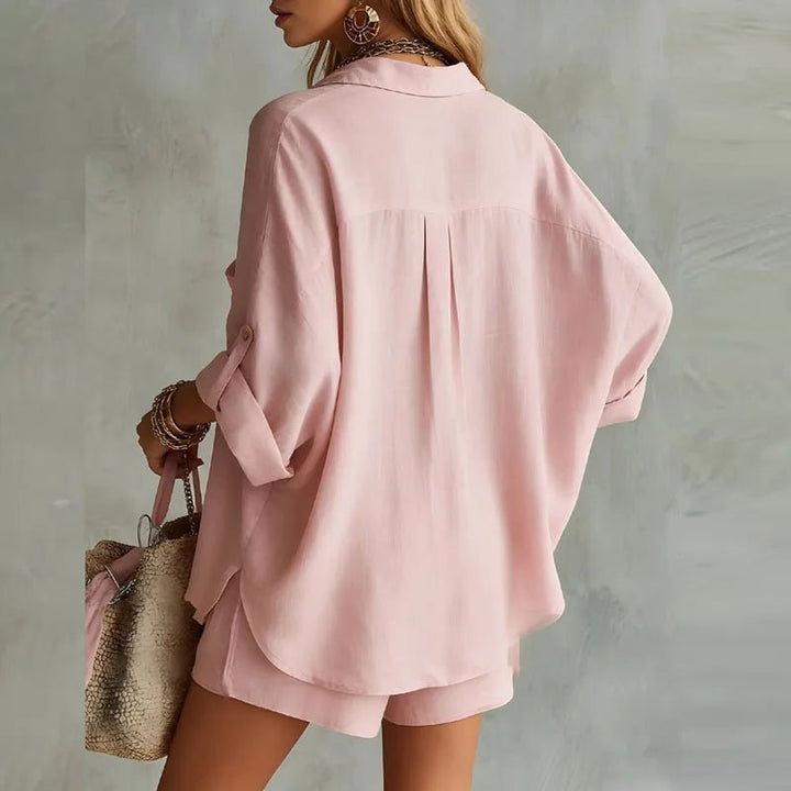 Casual women's button-down longline shirt and elastic waist shorts set. Perfect two-piece for resort wear.
