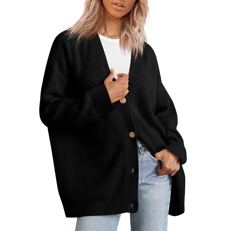 Women's oversized button-up cardigan in a relaxed fit, perfect for cozy fall & winter layering.