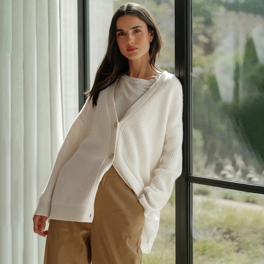 Women's cozy V-neck button-up cardigan, a key layering piece for transitional weather.