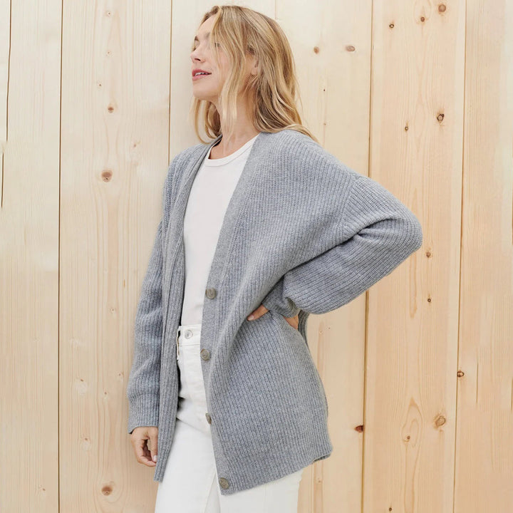 Long sleeve women's button-up cardigan, offering a cozy & oversized fit for everyday wear.