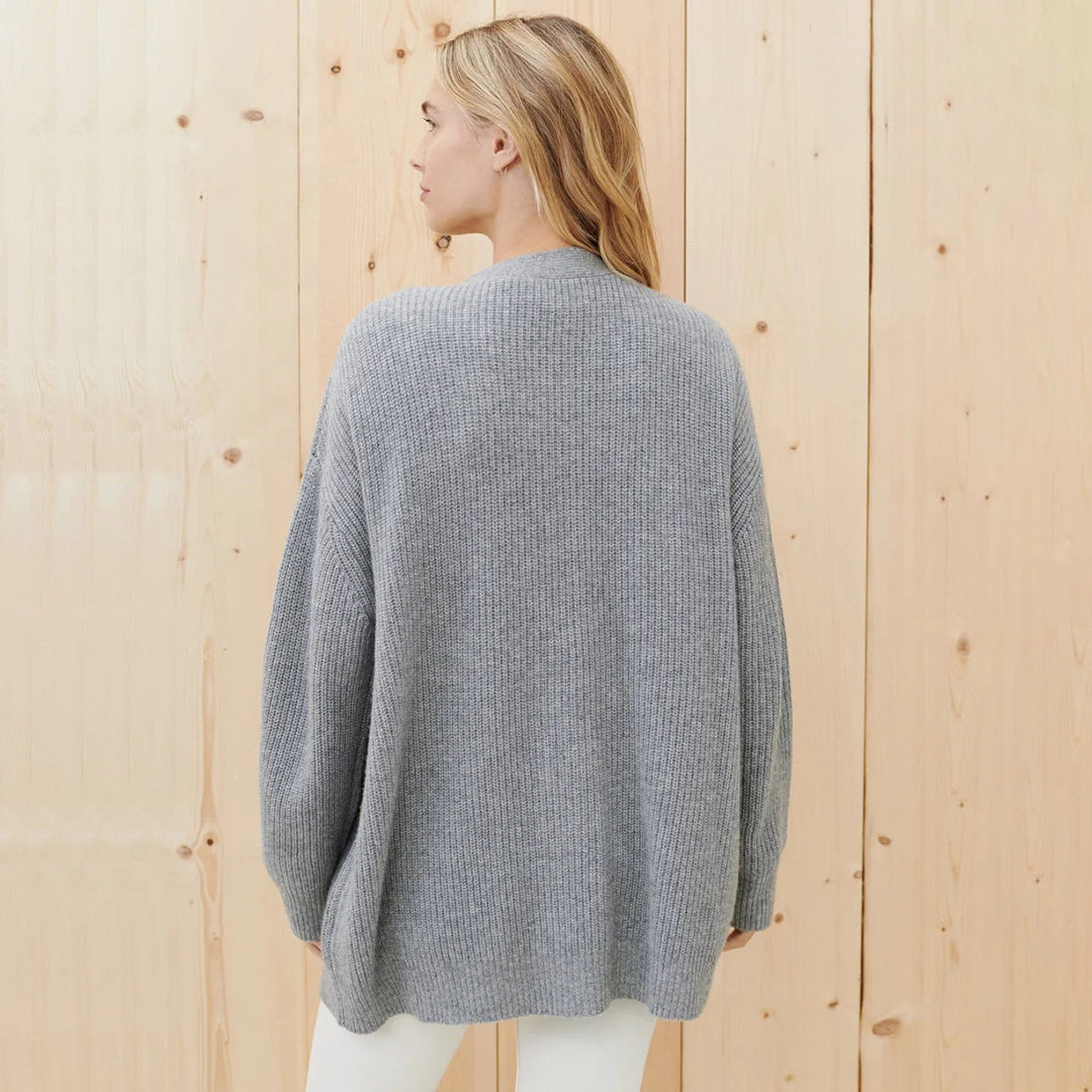Chic oversized knitwear cardigan with functional buttons, a must-have for winter layering.