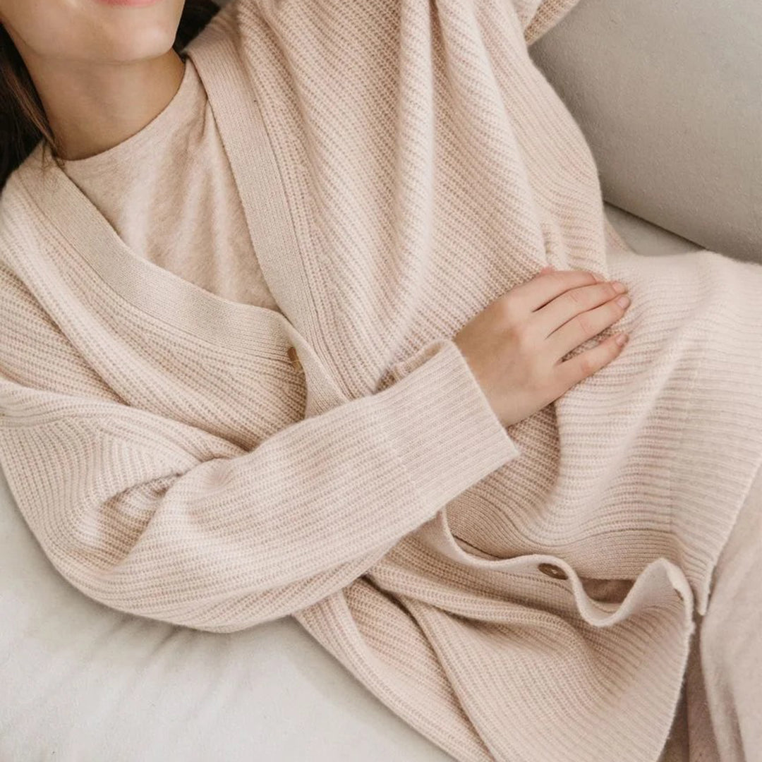 Front view of a women's oversized button-up cardigan, showcasing its soft knit texture.