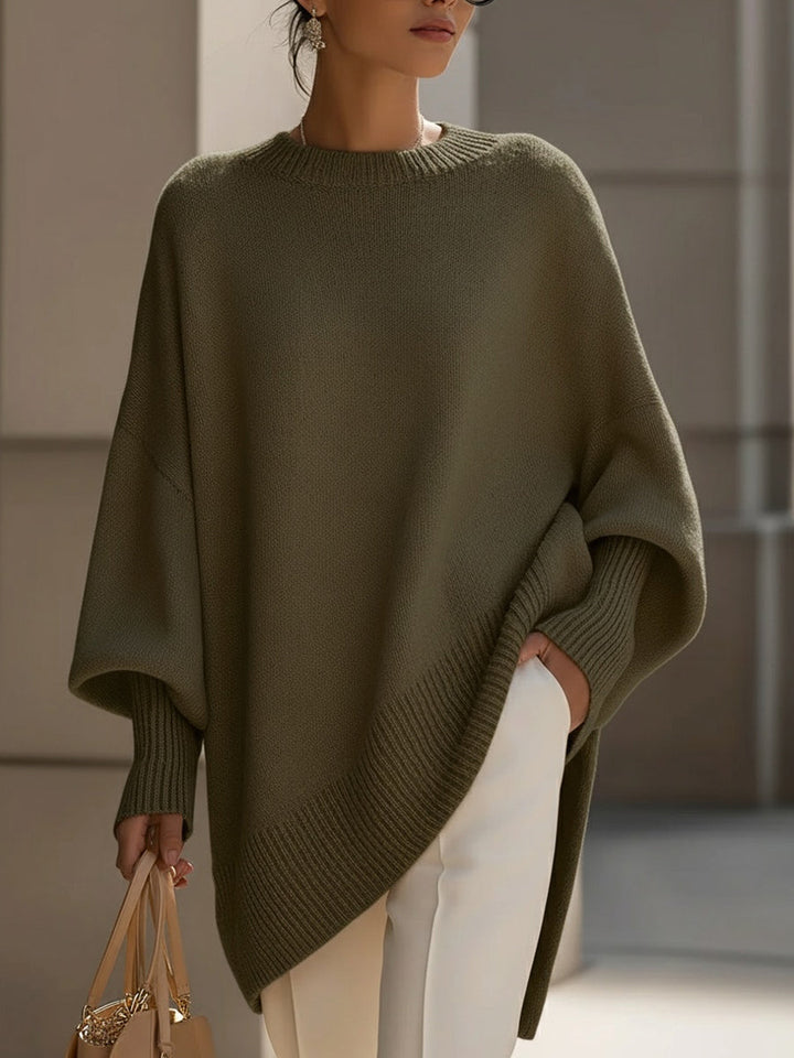 Elegant women's batwing sleeve cape sweater, an oversized knit perfect for stylish layering.