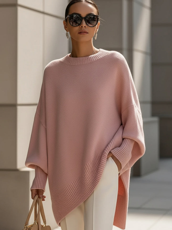 Stylish women's oversized batwing sleeve sweater, a chic poncho for elegant layering.