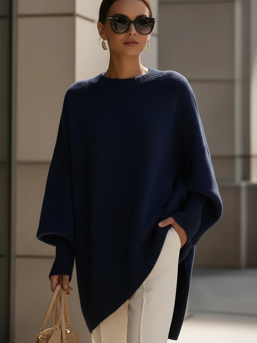 Comfortable women's cape sweater with batwing sleeves, a versatile oversized knit.